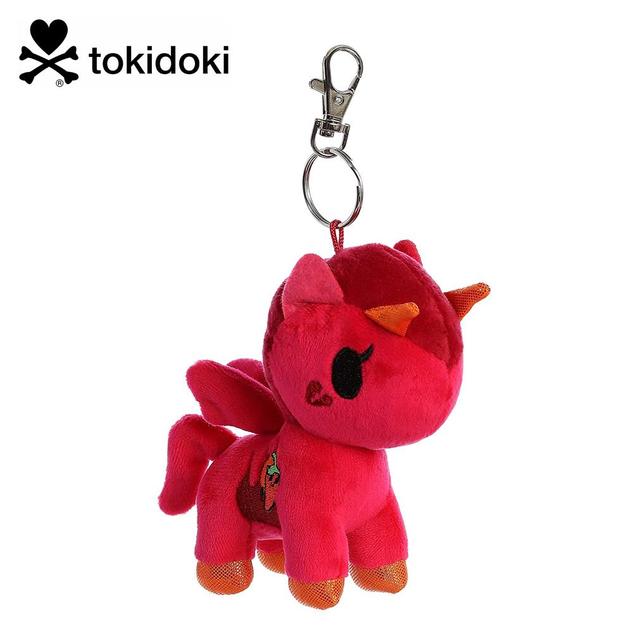 A keychain featuring a plush winged unicorn in red, with two orange devil horns, and a chilli pepper design on the side.