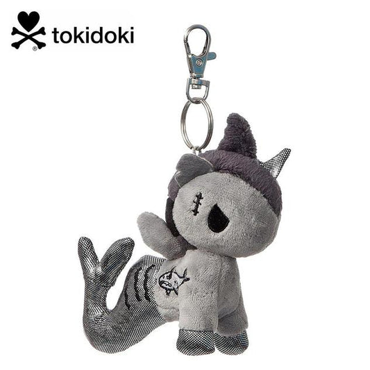 A keychain featuring a plush mermicorn in shades of grey, with an angry expression.