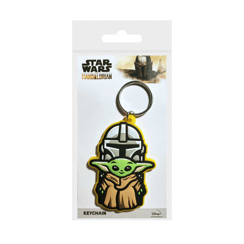 A rubber keychain featuring The Child facing forwards and smiling, with the distinctive helmet of The Mandalorian behind. 